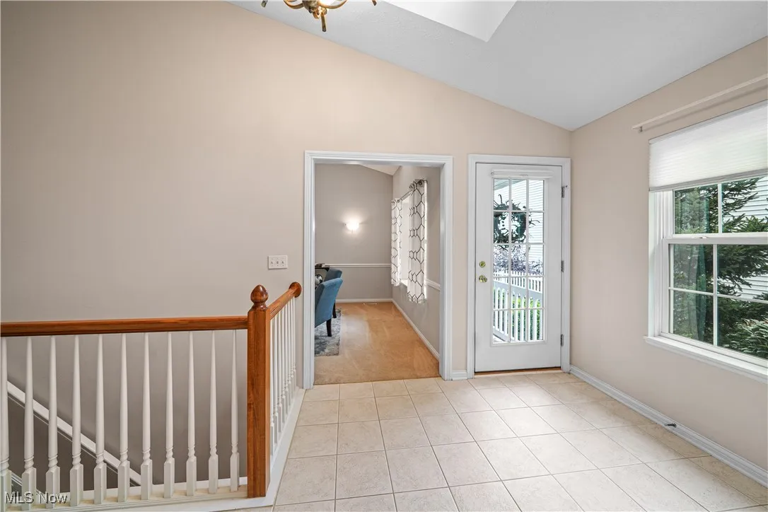 Foyer of the home and door to den/flex room.