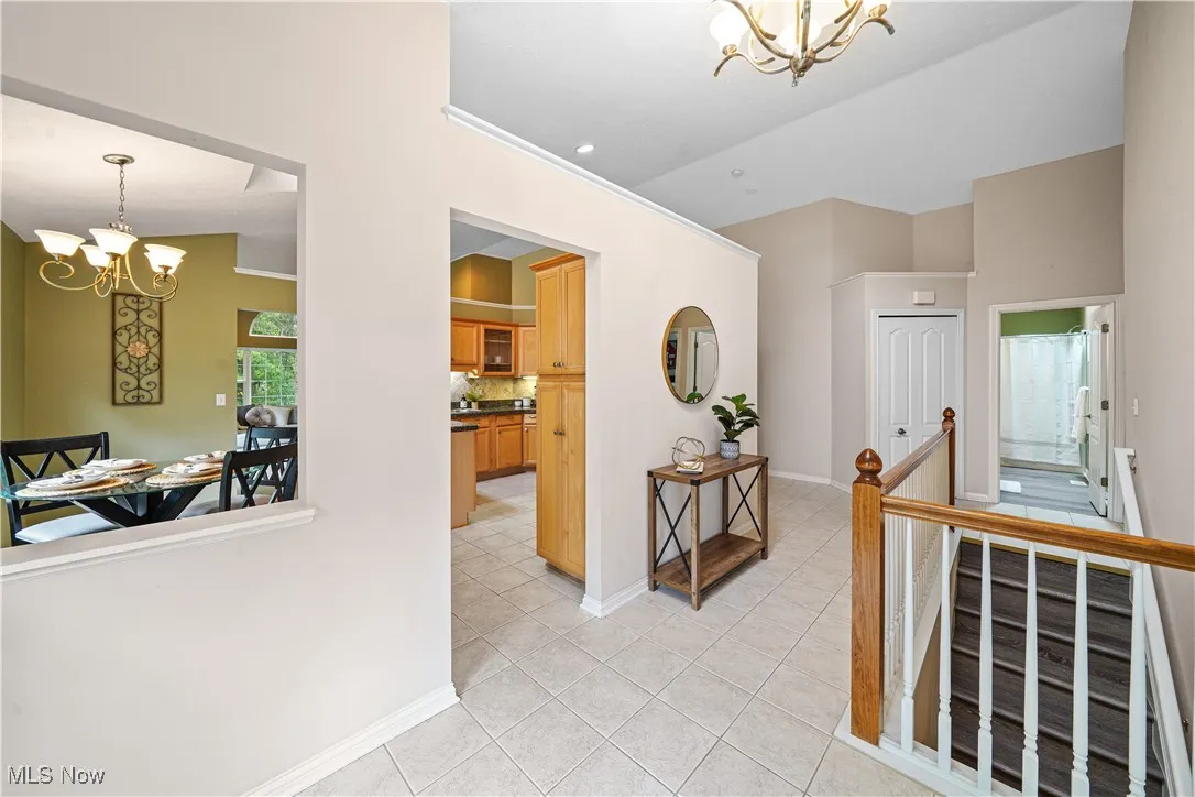 Foyer of the home with vaulted ceilings.