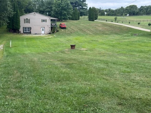 View of green lawn with a view of countryside