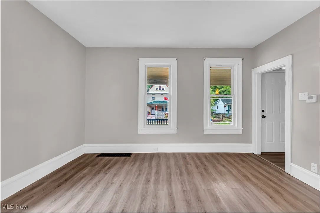 Empty room featuring wood finished floors