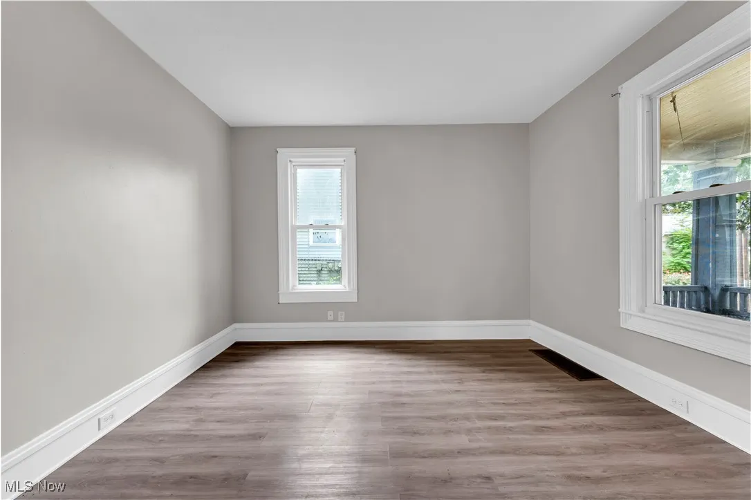 Unfurnished room with light wood-type flooring and plenty of natural light