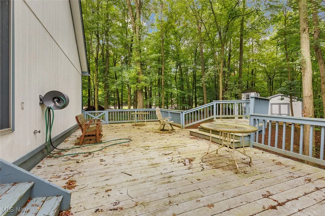 Wooden deck with a storage shed