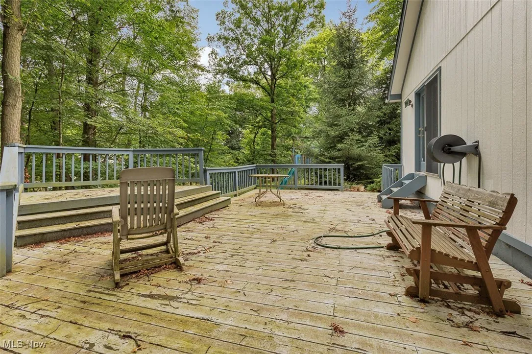 Deck with view of wooded area