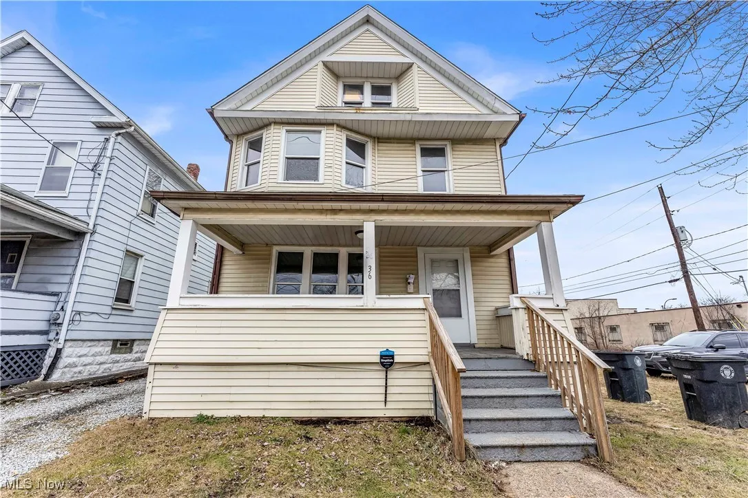 American foursquare style home with a porch