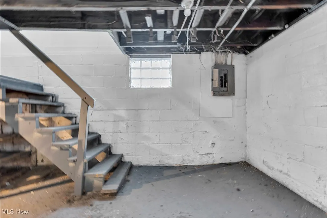 Basement featuring electric panel