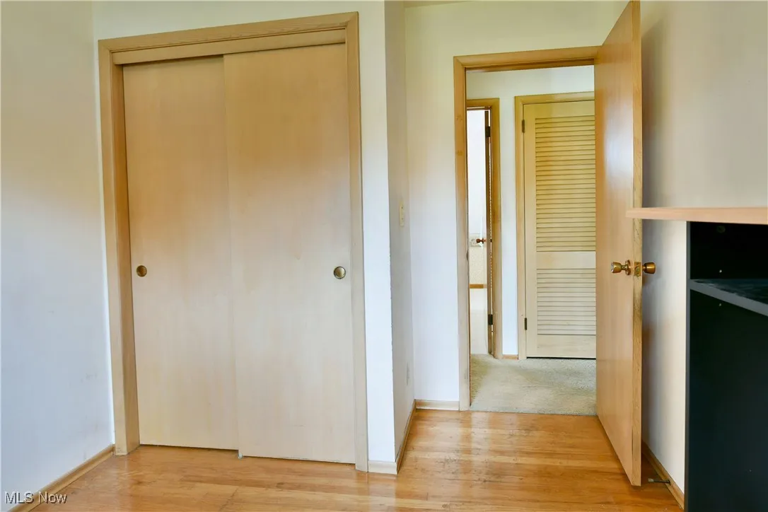 Corridor featuring light wood-style floors