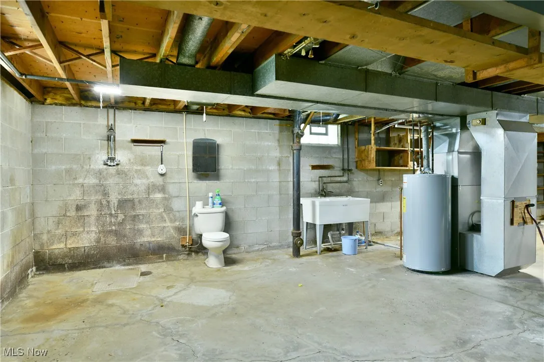 Basement with water heater and heating unit