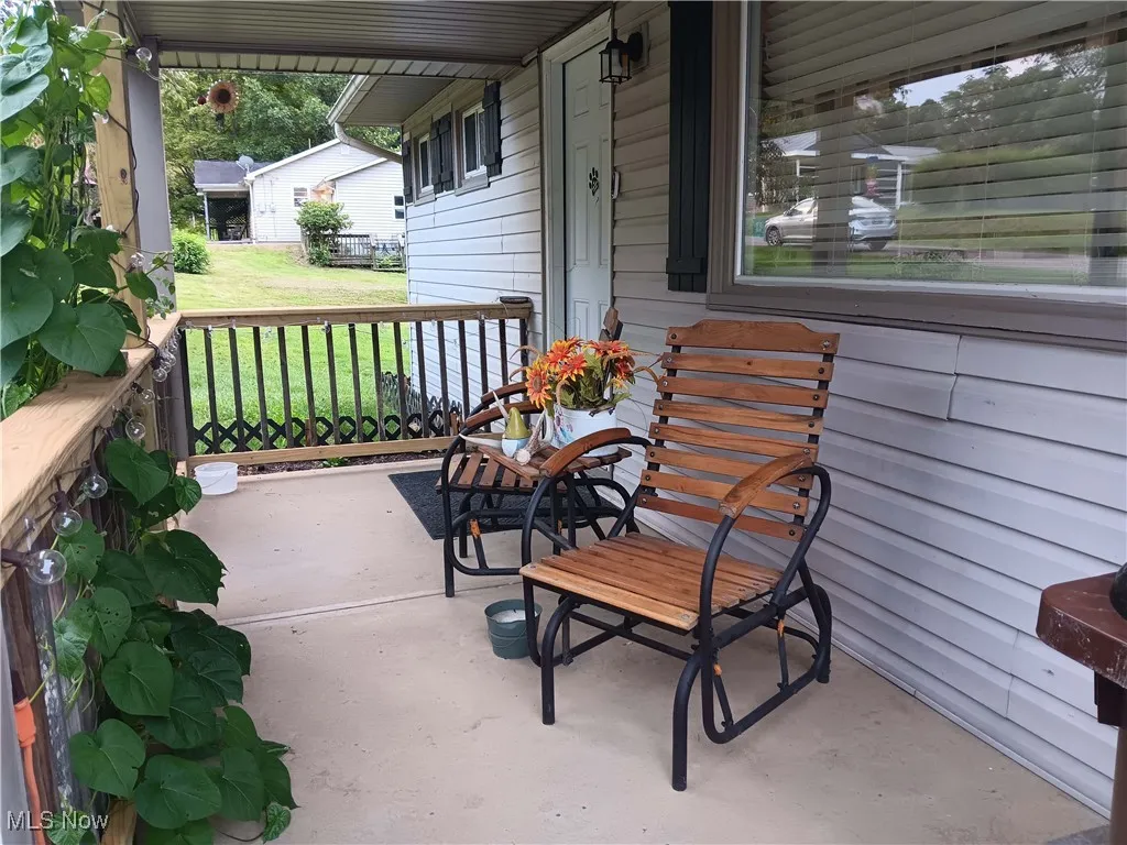 Porch featuring a yard