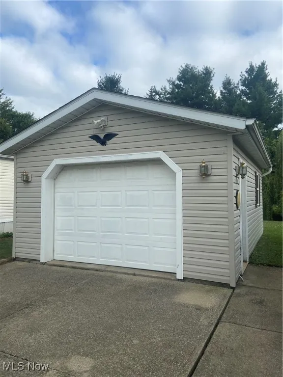 Garage featuring driveway