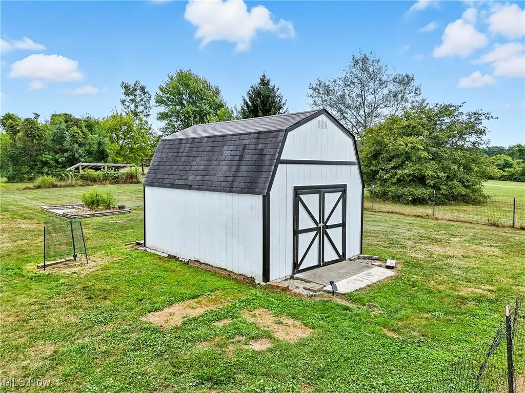 View of shed with view of scattered trees