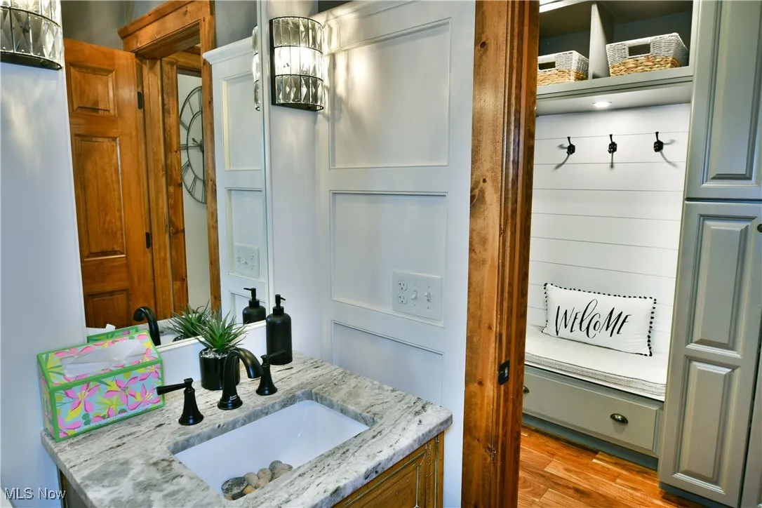 Bathroom with vanity and light wood-style floors