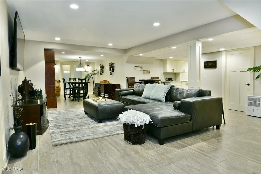 Living room with recessed lighting and light wood finished floors