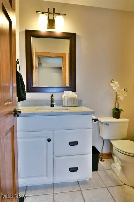 Bathroom with vanity and light tile patterned floors