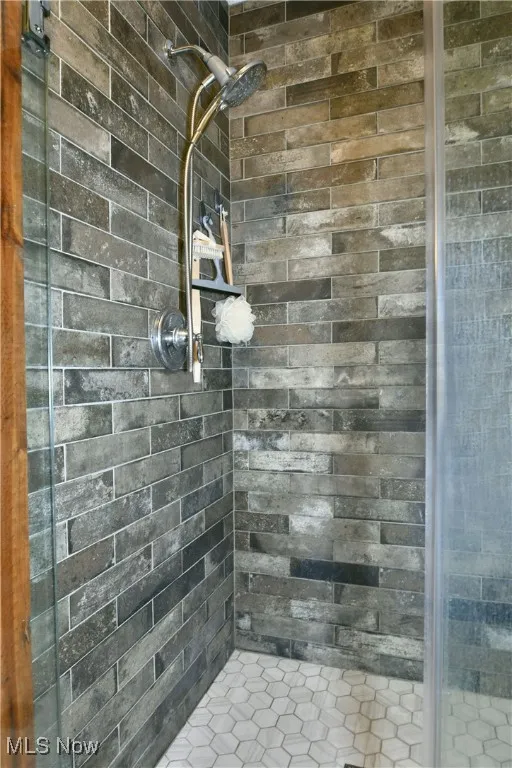Full bath featuring a stall shower
