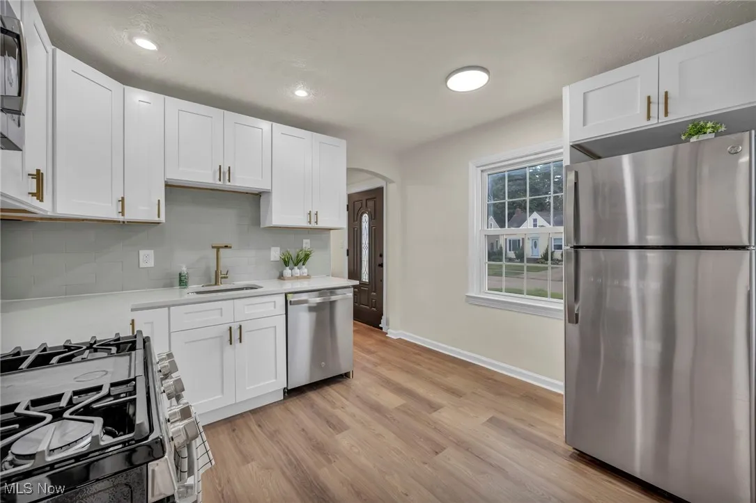 Kitchen featuring quartz countertops and new appliances