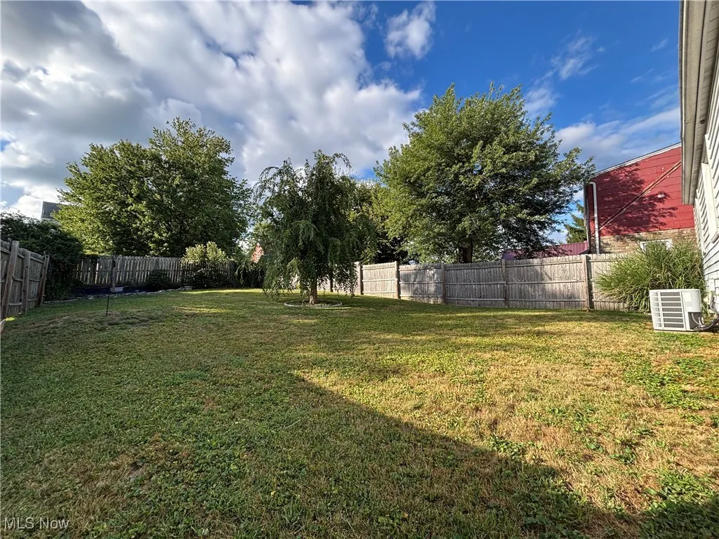 View of fenced backyard