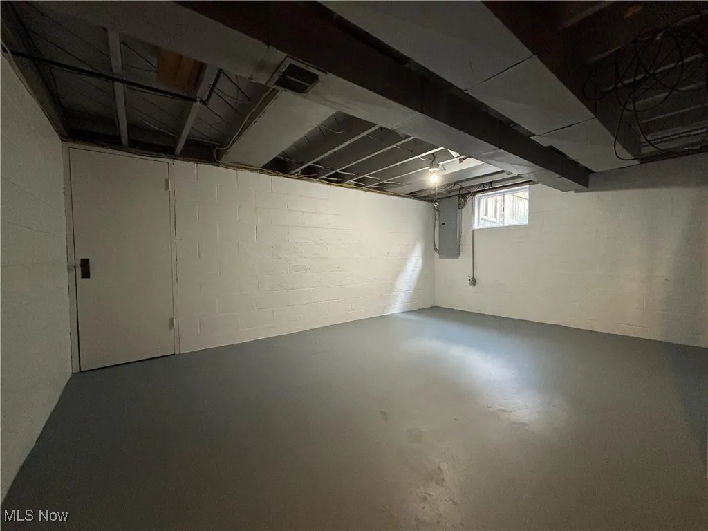 Basement featuring electric panel