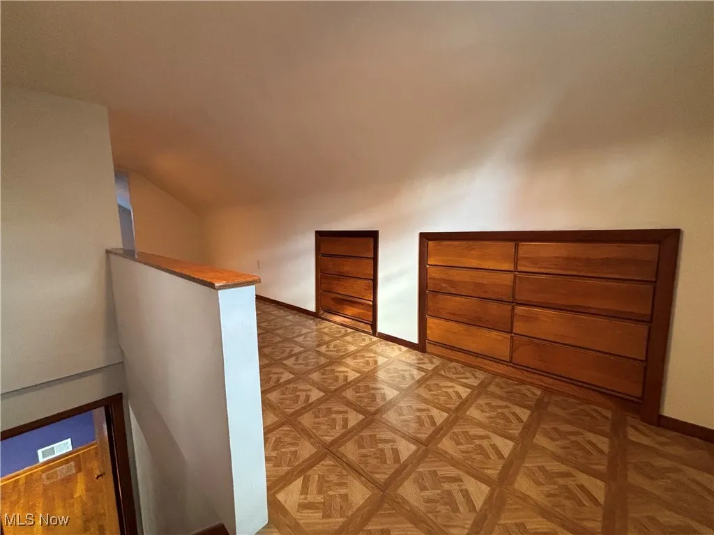 Bonus room featuring baseboards