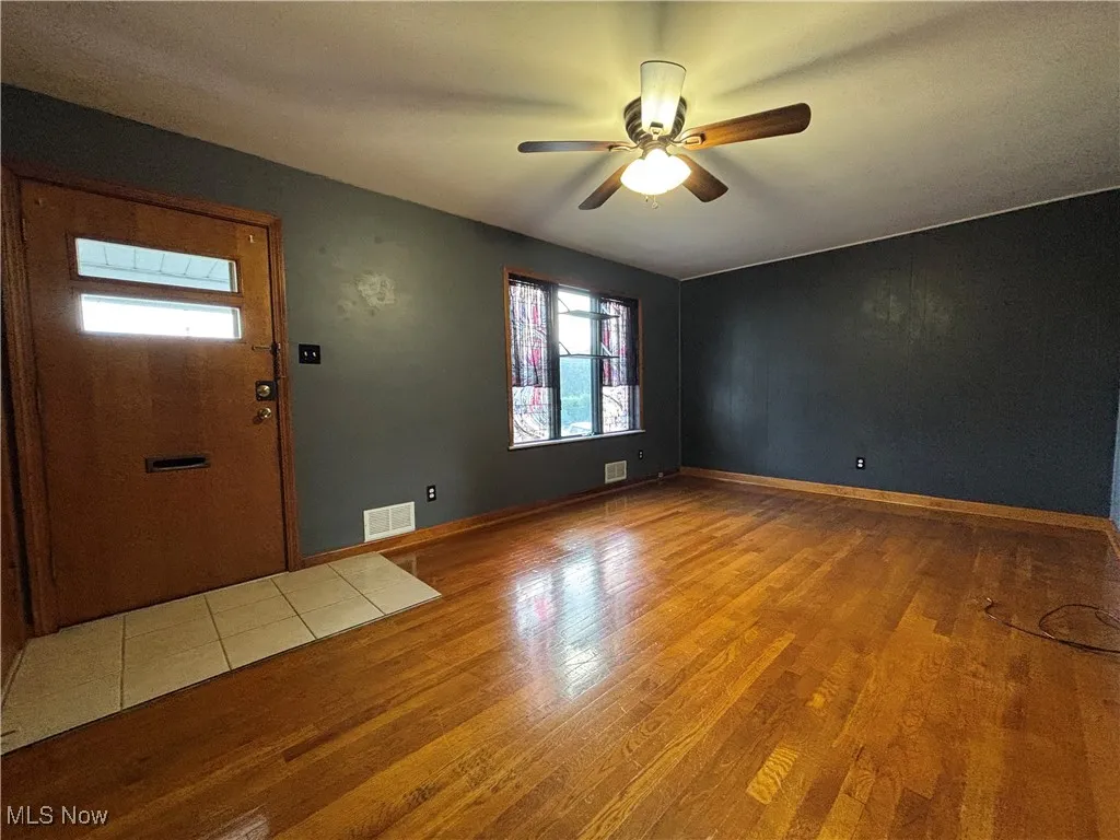Entryway with light wood-style flooring and ceiling fan