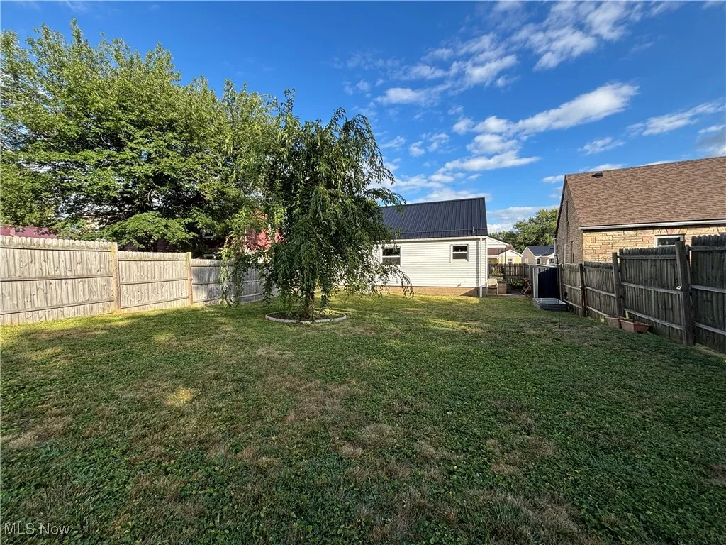 View of fenced backyard
