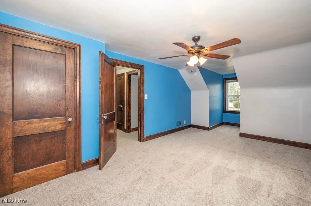 Third bedroom featuring new carpeting (august 2025), large closet and built in drawers