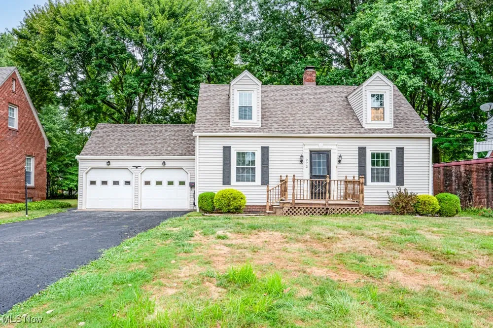 Front view of home with an attached two car garage with openers.