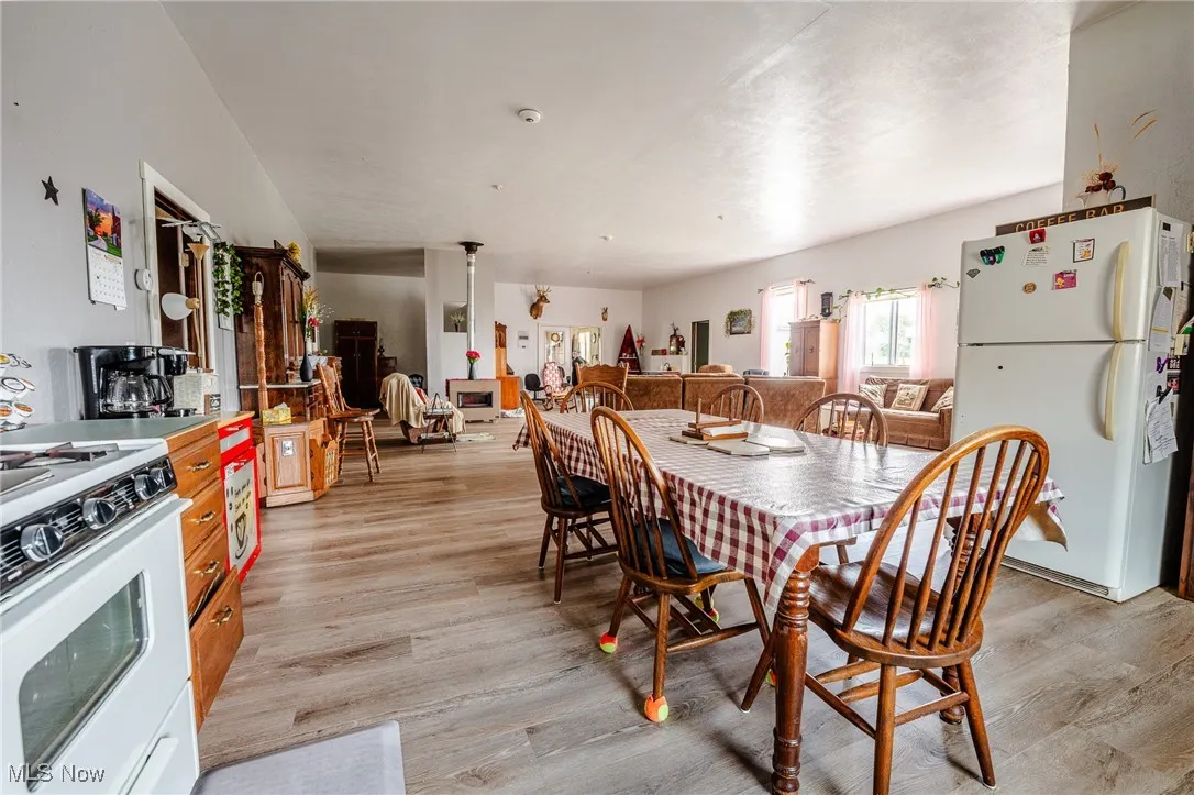 Dining area with light wood-style flooring