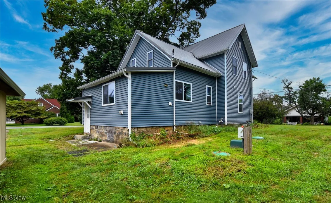 View of home's exterior featuring a lawn