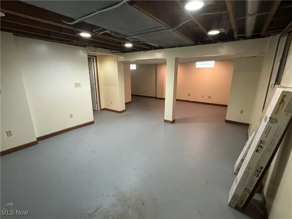 Basement featuring baseboards