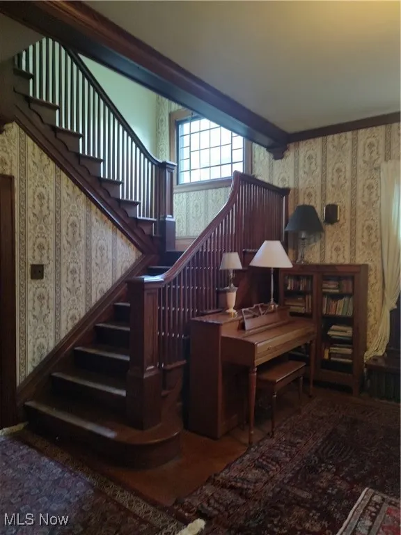 Foyer and lovely natural woodwork stairway