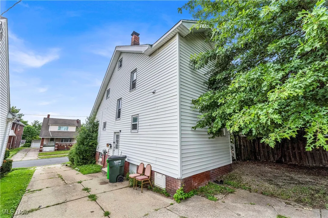View of home's exterior with a chimney