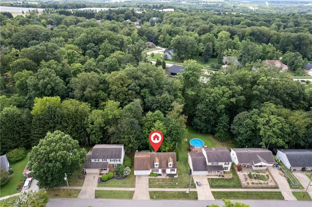 Aerial view of residential area with a forest