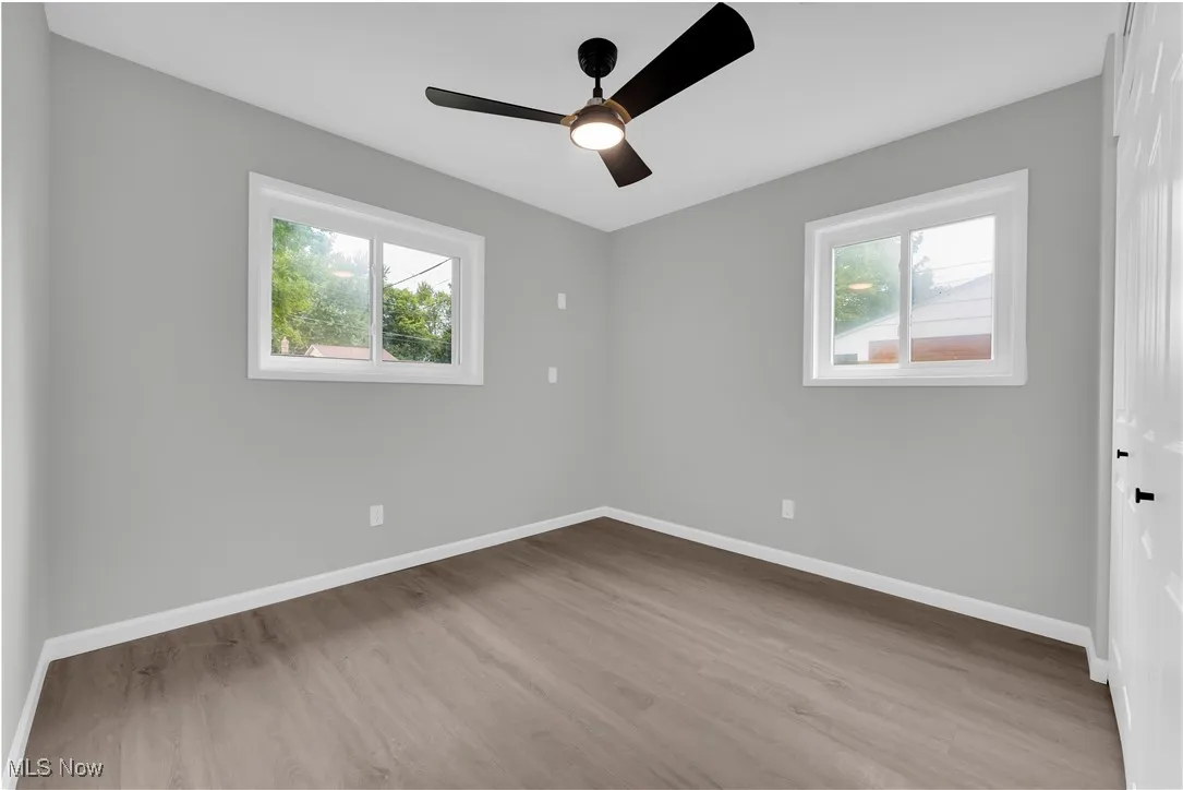 Spare room with light wood-type flooring and a ceiling fan