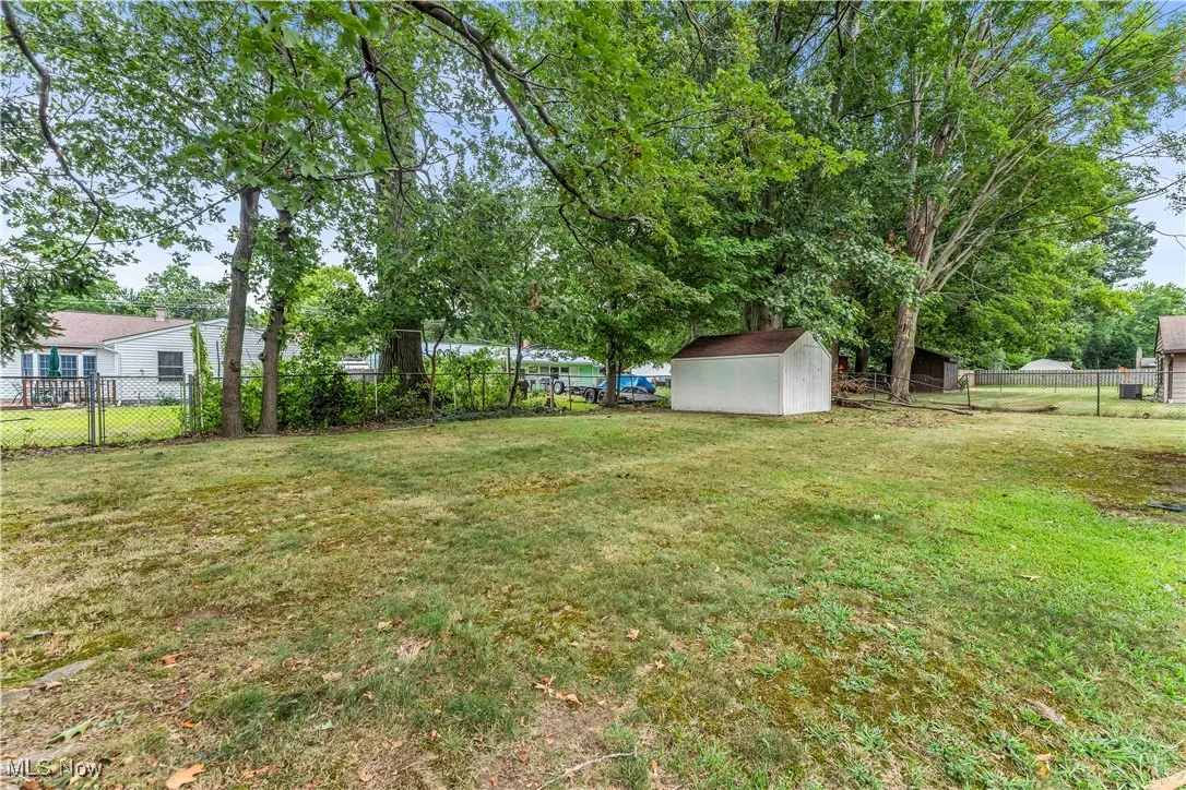 Fenced backyard with a shed