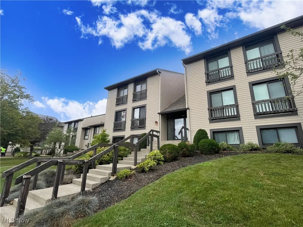 View of building exterior with a residential view