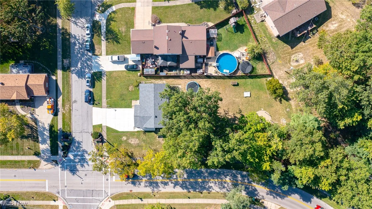 View from above of property showing treed corner lot