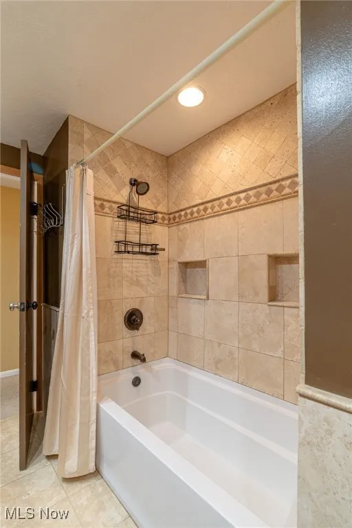 Full bathroom featuring shower / tub combo, recessed lighting, and tile patterned floors