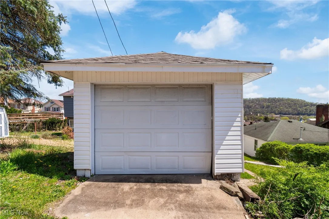 Detached garage with concrete driveway