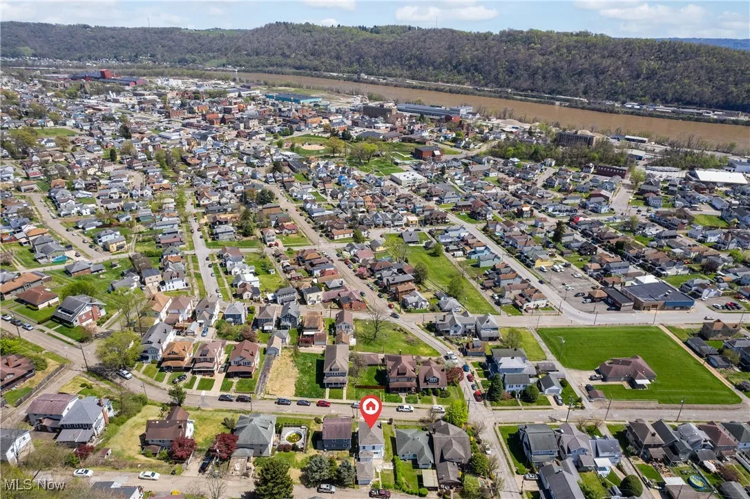 Aerial overview of property's location featuring nearby suburban area