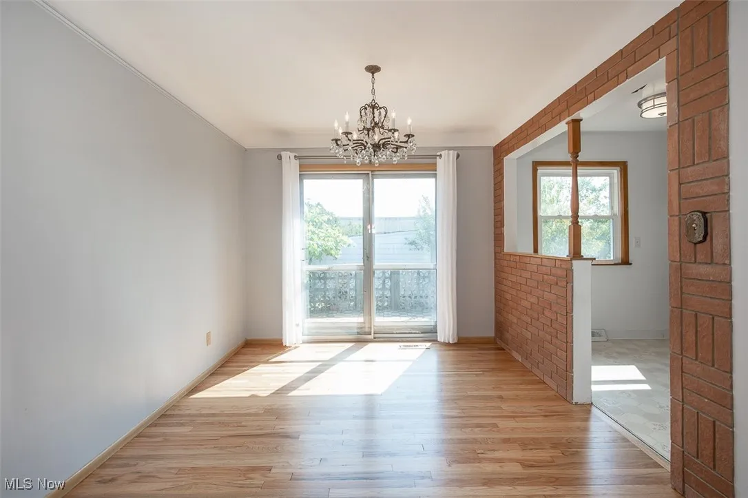 Dining room facing patio with kitchen to the right.
