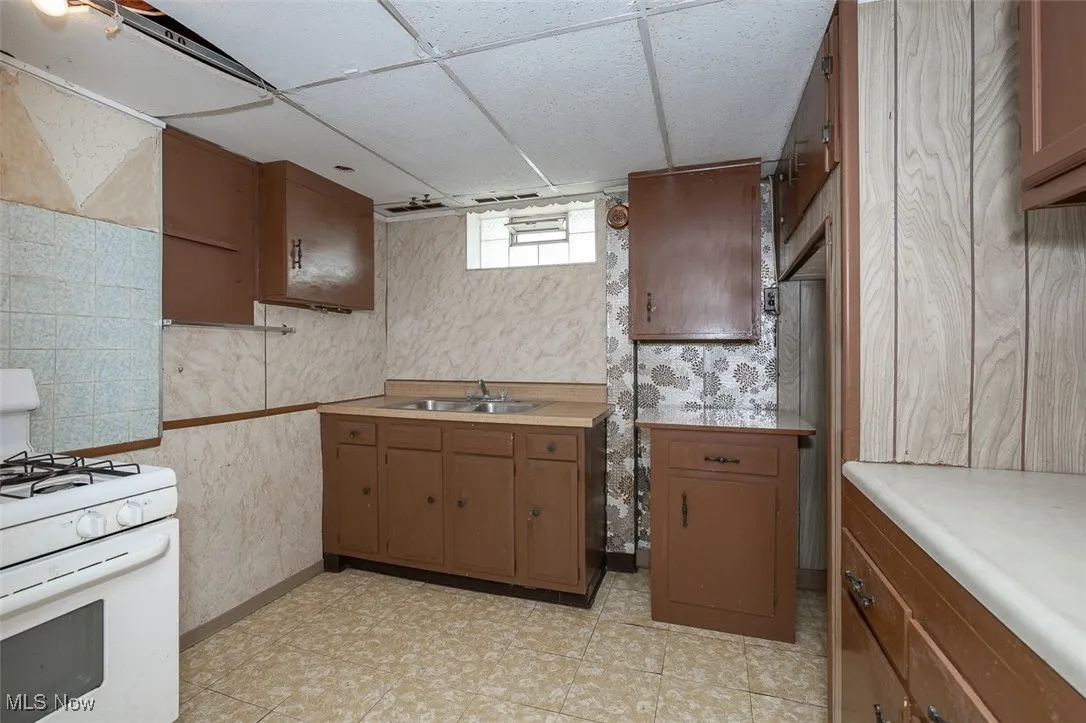 Basement kitchen facing sink.