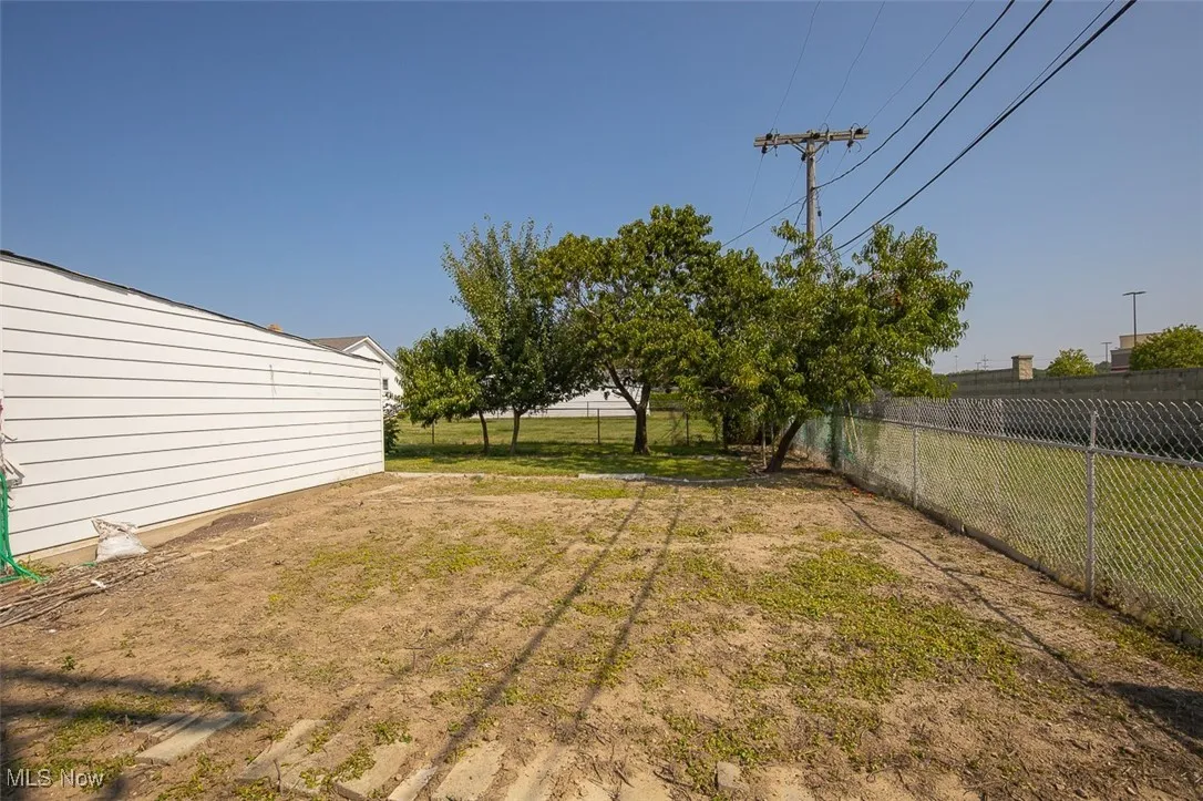 Garden area facing fruit trees.