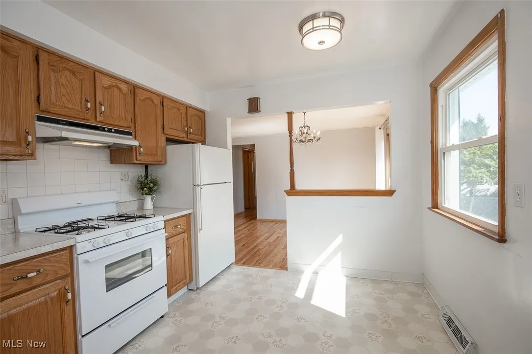 Eat-in kitchen facing dining room.