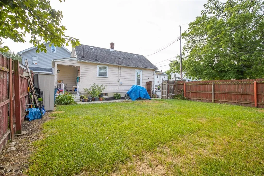 Rear view of house with a fenced backyard Between Main house and Second house