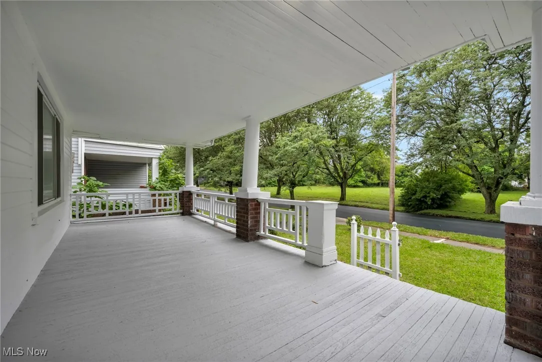 Porch featuring a yard