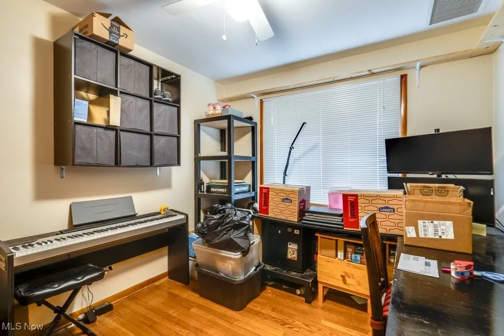 Bedroom featuring light wood-type flooring and ceiling fan