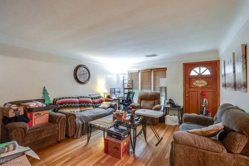 Living room with light wood-style flooring
