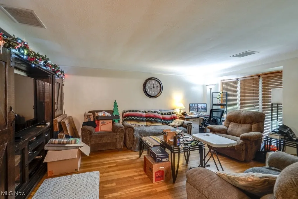 Living area featuring wood finished floors