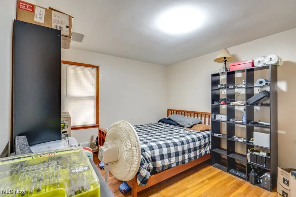 Bedroom with light wood-style floors