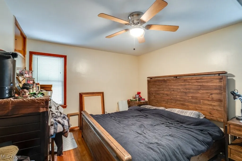 Bedroom with wood finished floors and ceiling fan